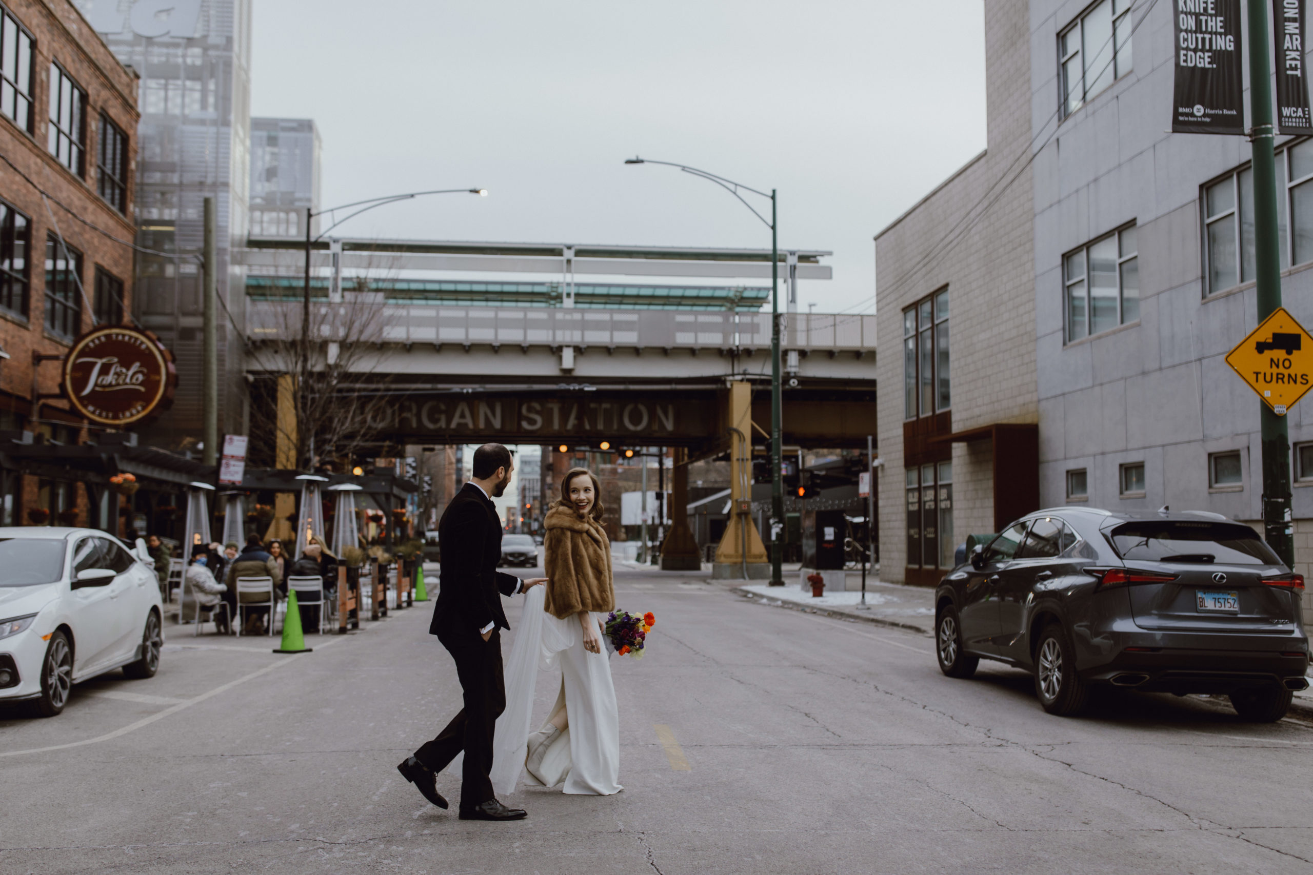 Couple in front of Morgan Station in Chicago.